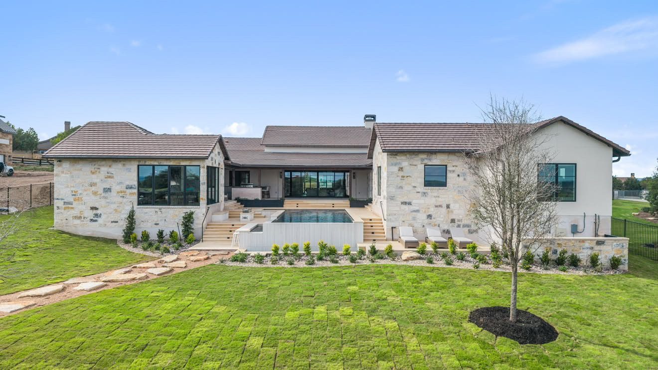 Completed Texas Hill Country custom home with negative-edge pool