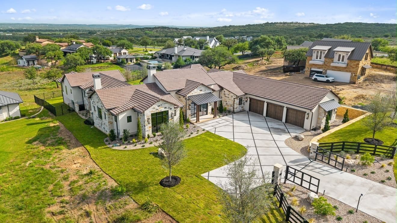 Aerial view of the completed home on its lot